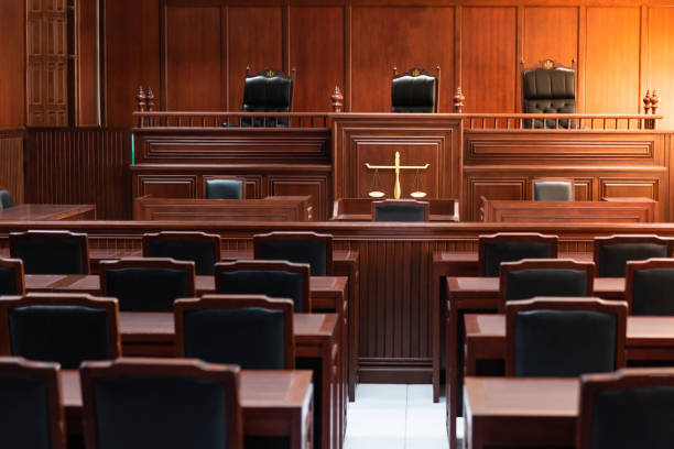 red wood table and red chair in the justice court